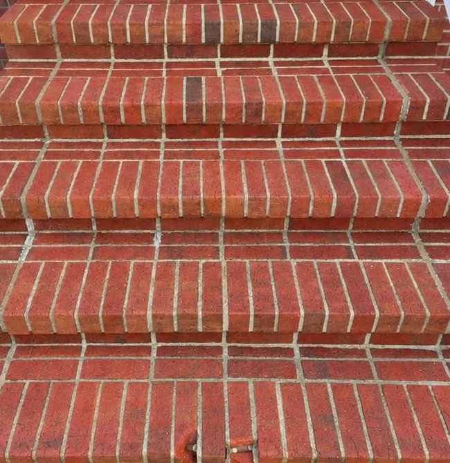 Red brick front steps after cleaning